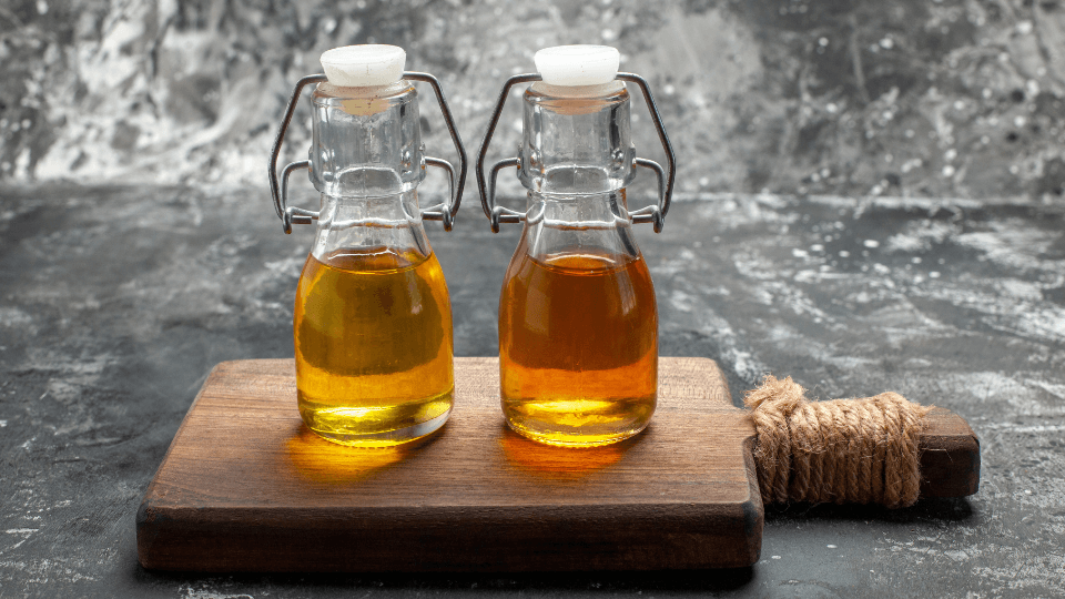 Food-safe board oil beside a bamboo chopping board