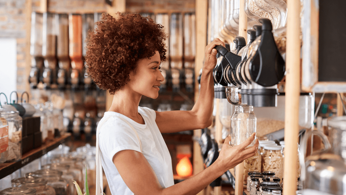 Woman Buying Cereals and Grains in Sustainable Plastic Free Grocery