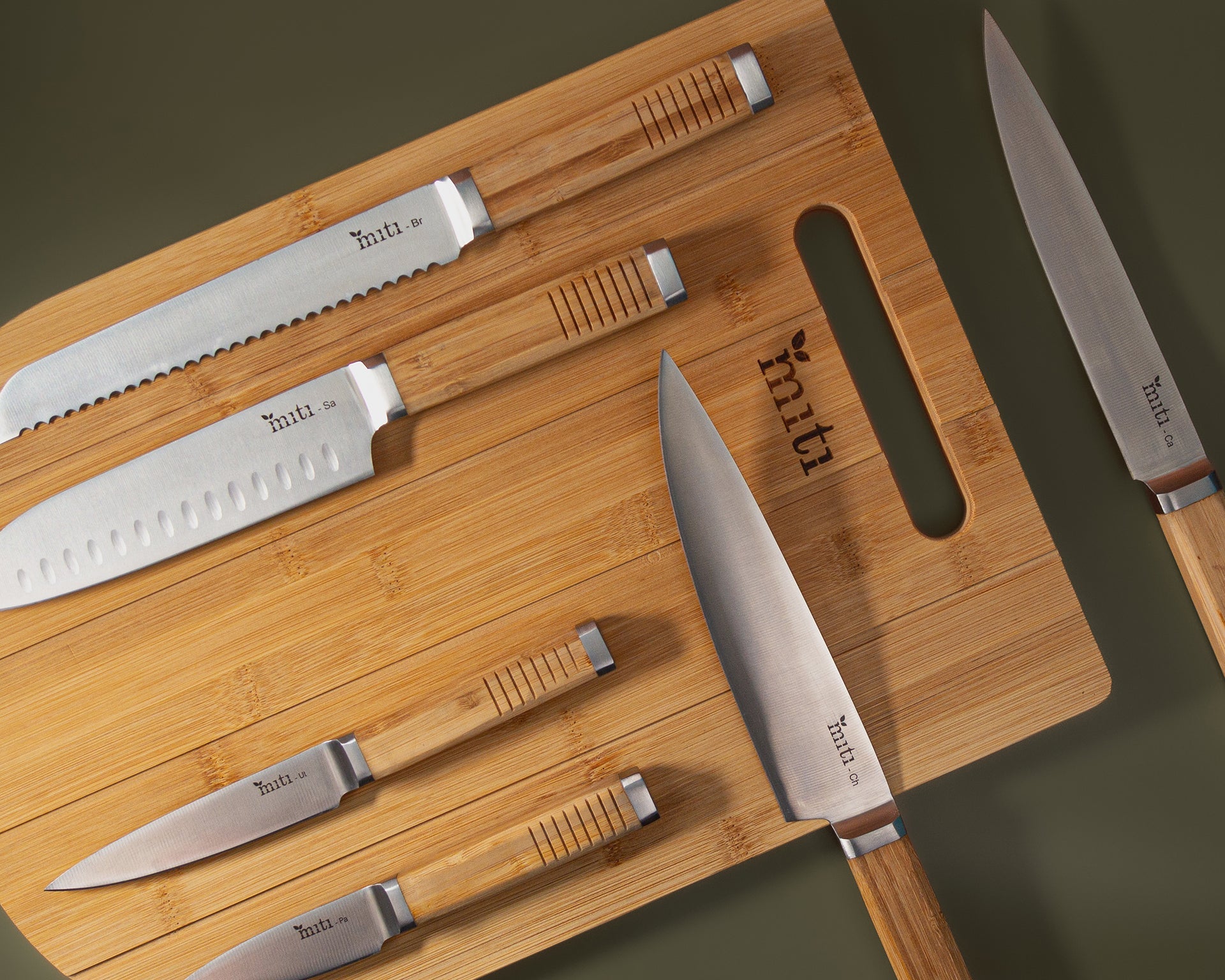 MITI six-piece kitchen knife set arranged together for comparing a complete set with individual knives