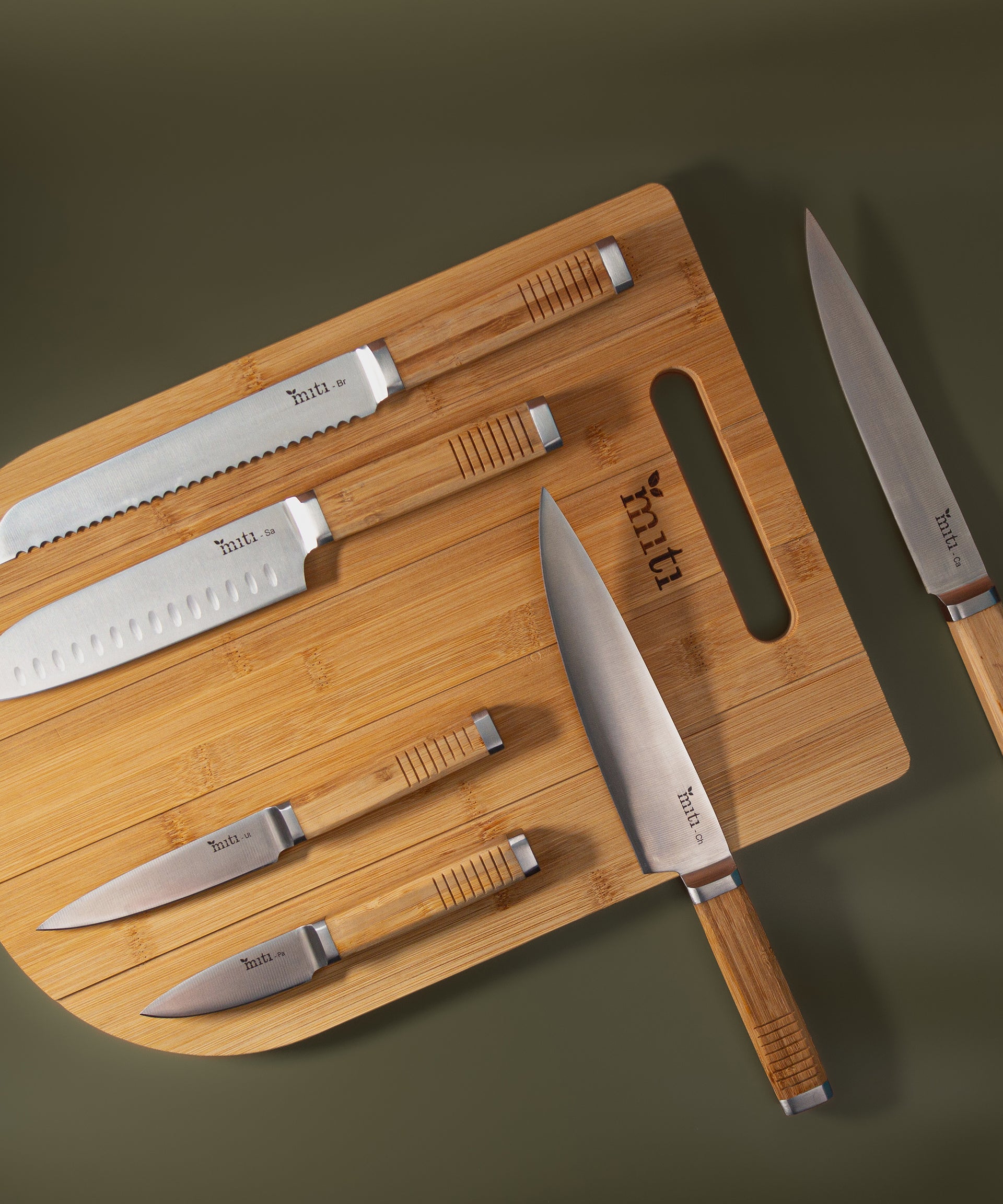 MITI six-piece kitchen knife set arranged together for comparing a complete set with individual knives