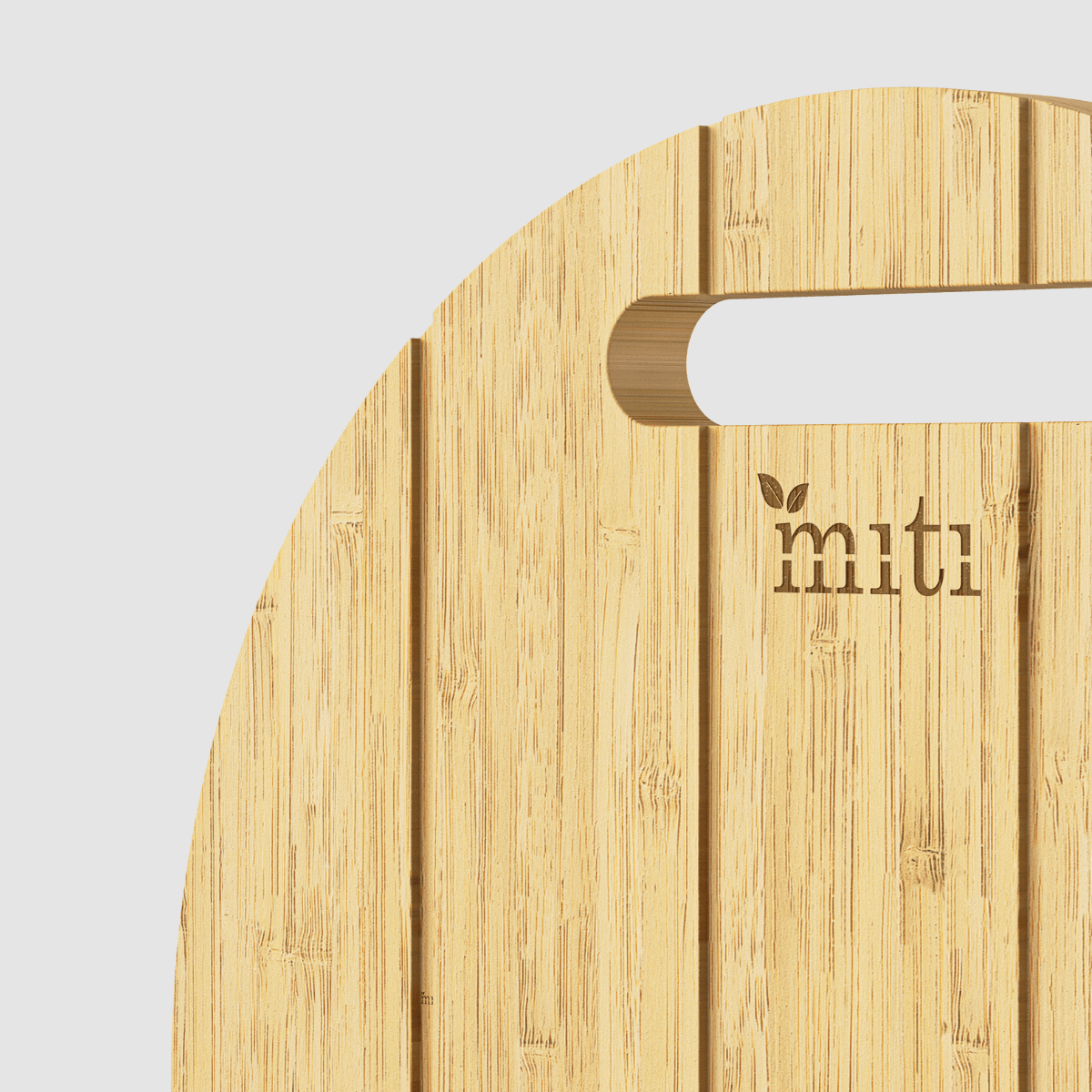 close up shot of the upper part and handle of rounded chopping board by MITI Life